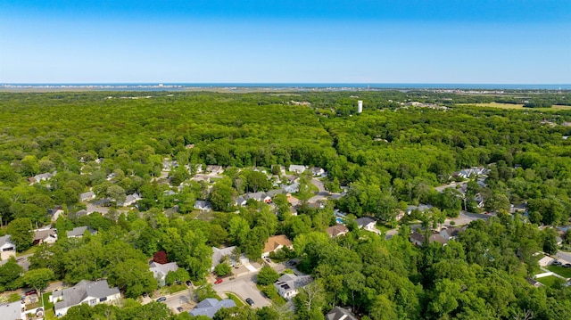 24 Heron Way N, Cape May, NJ 08204 - aerial view of property and surrounding area featuring a heavily wooded area and nearby suburban area