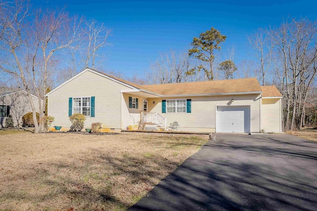 ranch-style home with a garage, crawl space, aphalt driveway, and a front yard