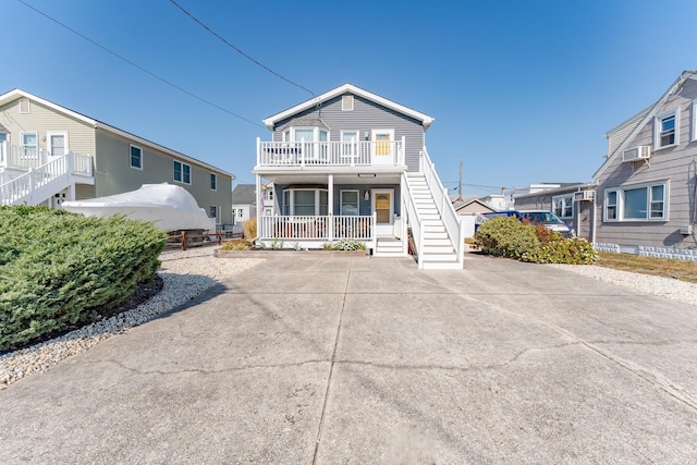 view of front of property featuring a porch and cooling unit