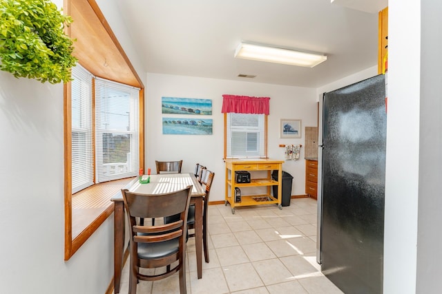 dining room with light tile patterned floors