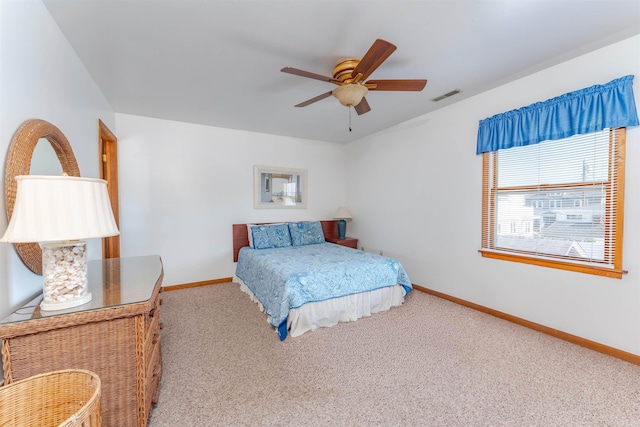 bedroom with ceiling fan and carpet floors