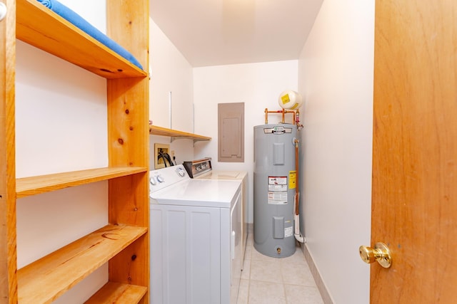 clothes washing area featuring cabinets, electric water heater, electric panel, light tile patterned floors, and separate washer and dryer