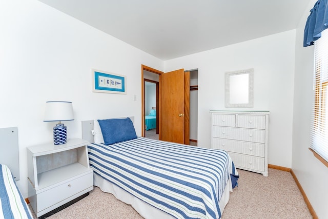 bedroom featuring light colored carpet