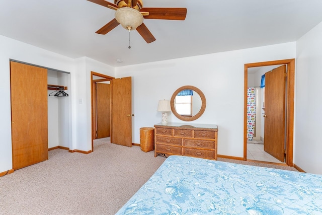 carpeted bedroom featuring a closet and ceiling fan