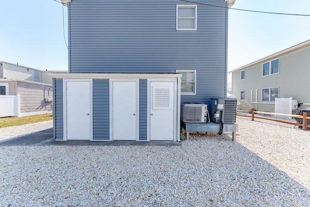 rear view of property featuring cooling unit