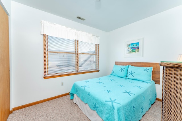 bedroom with light colored carpet