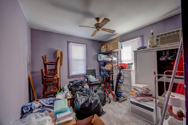 interior space featuring ceiling fan, carpet flooring, and a wall mounted AC