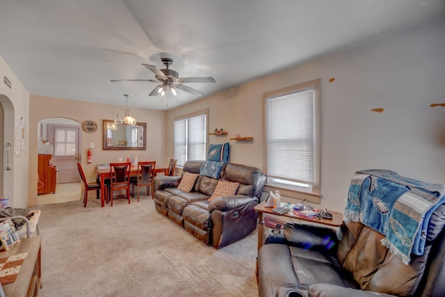 carpeted living room featuring ceiling fan