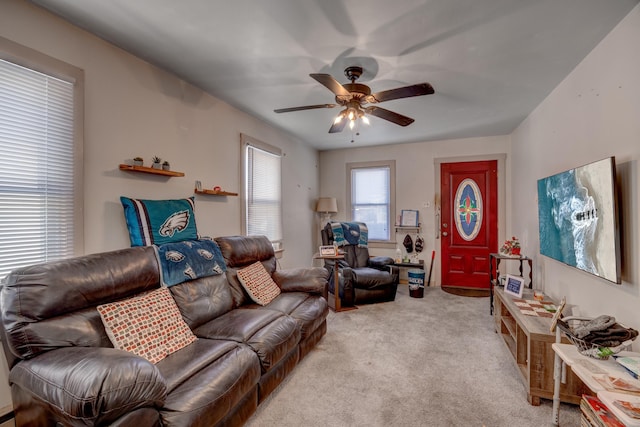 living room with ceiling fan and light carpet