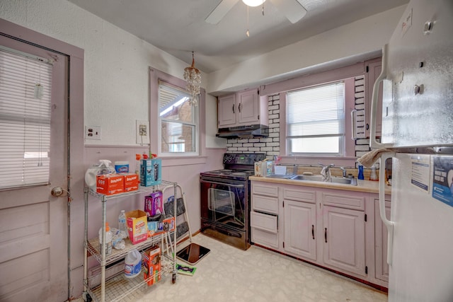 kitchen with ceiling fan, sink, black electric range oven, and white fridge