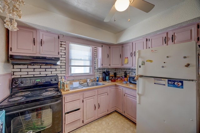 kitchen with ceiling fan, black range with electric stovetop, sink, and white refrigerator