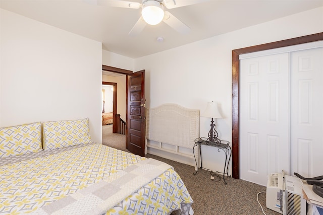 carpeted bedroom featuring ceiling fan and a closet