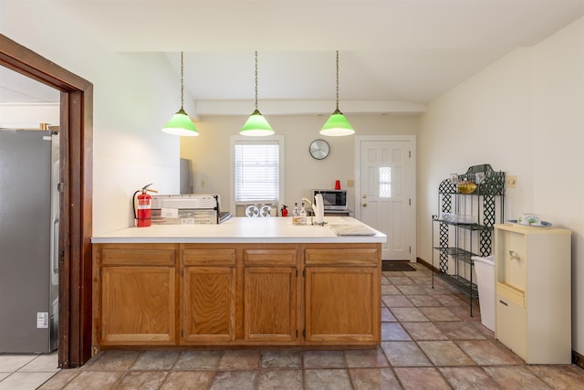 kitchen featuring hanging light fixtures and stainless steel appliances