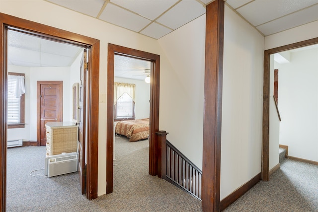 hall with carpet and a baseboard radiator
