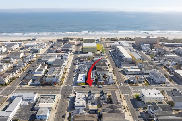 aerial view with a view of the beach and a water view