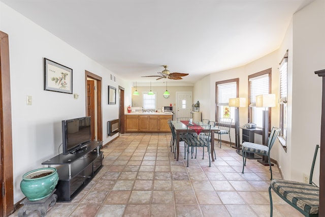 dining room with a wealth of natural light and ceiling fan