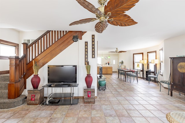 tiled living room with plenty of natural light