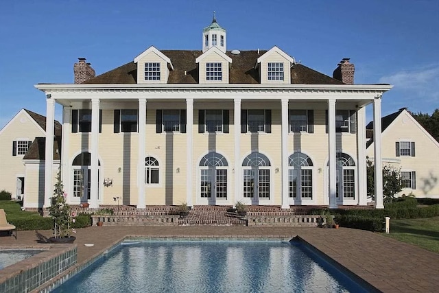 rear view of house with a patio area