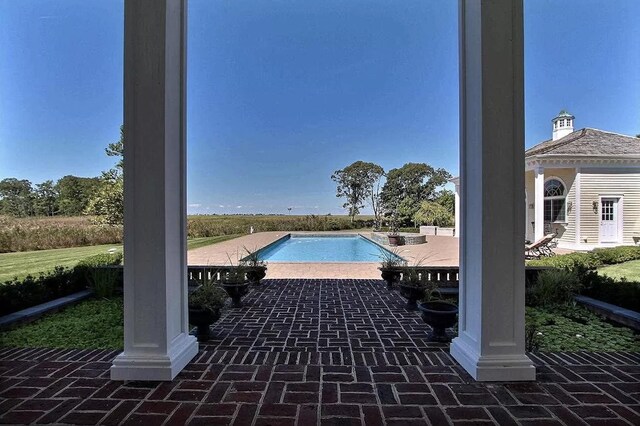 view of swimming pool with a patio