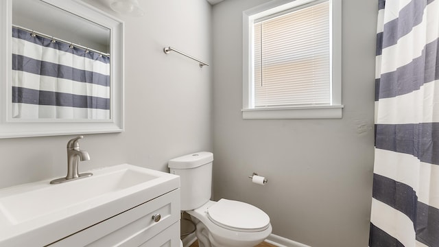 bathroom with vanity and toilet