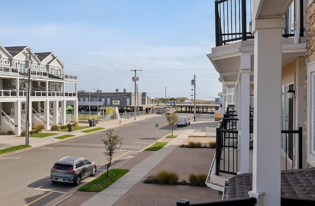 view of road with curbs and sidewalks