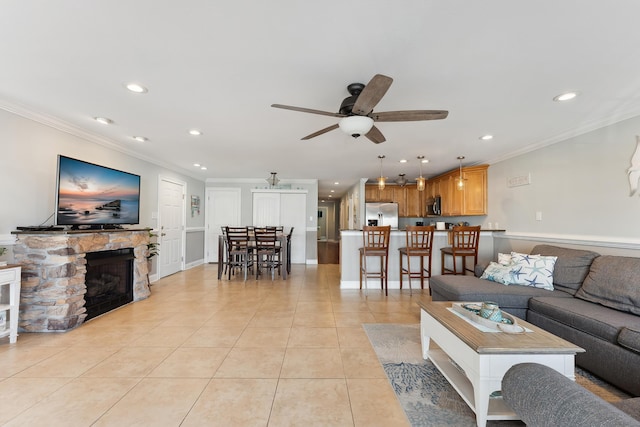 living room with recessed lighting, a ceiling fan, crown molding, and light tile patterned flooring