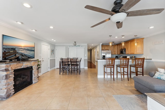 living room with ornamental molding, recessed lighting, light tile patterned flooring, and ceiling fan