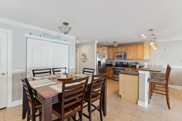 dining room with ornamental molding, recessed lighting, and light tile patterned floors