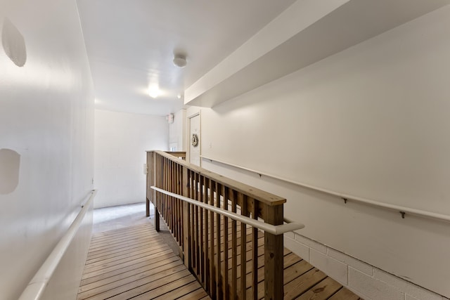 staircase featuring wood finished floors