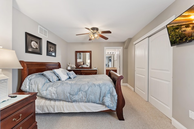 bedroom with carpet, a closet, visible vents, a ceiling fan, and baseboards