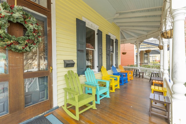 wooden deck featuring covered porch