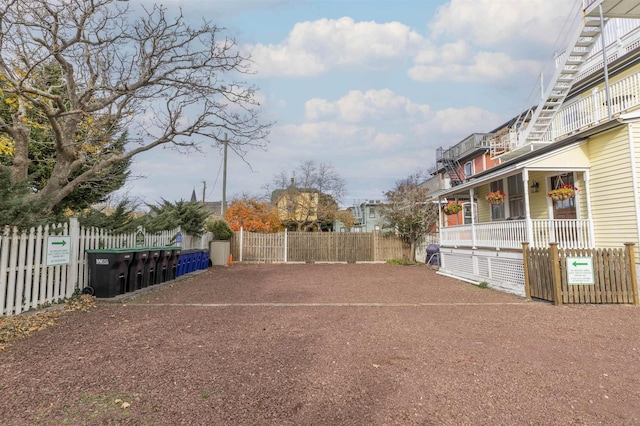 view of yard with covered porch
