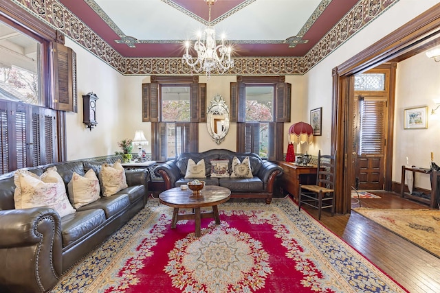 living room featuring hardwood / wood-style floors and a notable chandelier