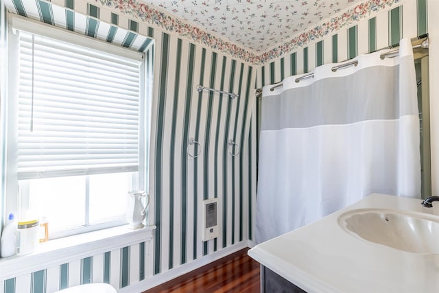 bathroom with hardwood / wood-style floors and sink