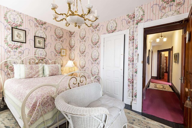 bedroom with a notable chandelier
