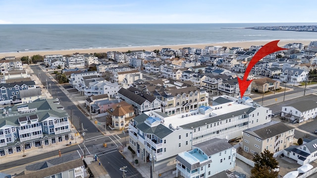 aerial view with a view of the beach and a water view