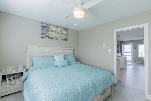 145 Seaview Ct Unit A7, North Wildwood, NJ 08260 - bedroom with light wood finished floors, ceiling fan, and baseboards