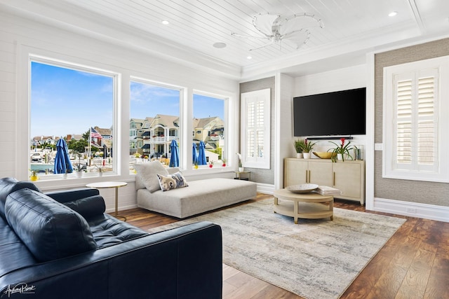 living room with hardwood / wood-style flooring, ornamental molding, and wood ceiling