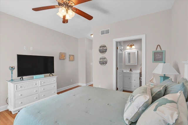 102 E 8 Th Ave, North Wildwood, NJ 08260 - bedroom with light wood finished floors, ensuite bathroom, and a ceiling fan
