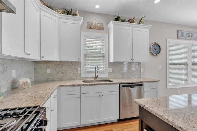 102 E 8 Th Ave, North Wildwood, NJ 08260 - kitchen with stainless steel dishwasher, white cabinetry, recessed lighting, light stone counters, and decorative backsplash