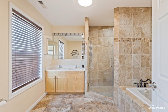 bathroom featuring vanity and plus walk in shower