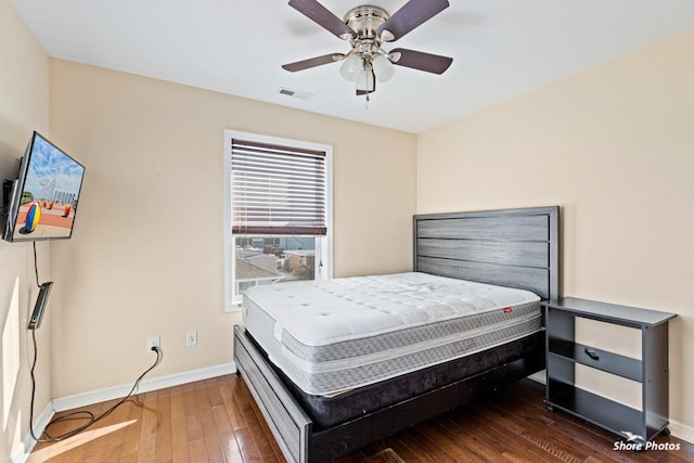 bedroom featuring hardwood / wood-style flooring and ceiling fan