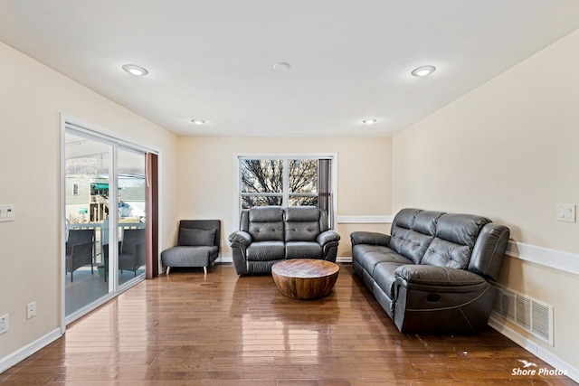 living room with plenty of natural light and hardwood / wood-style floors