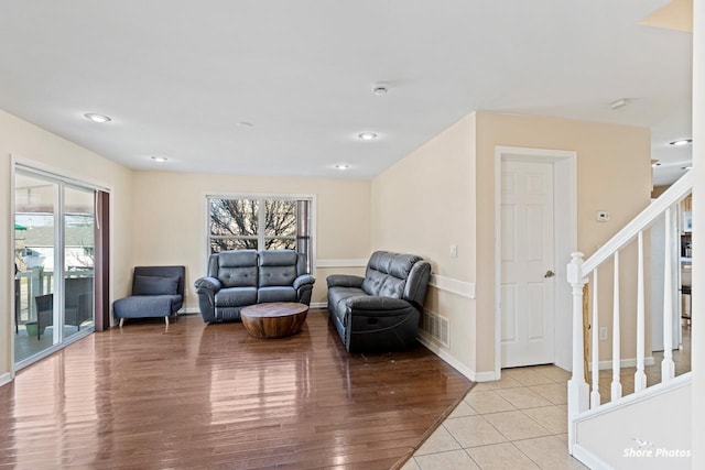 living room with light hardwood / wood-style flooring