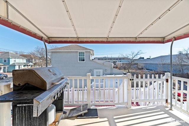 view of patio featuring grilling area and a deck