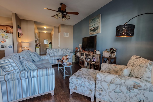 living room featuring dark hardwood / wood-style floors and ceiling fan