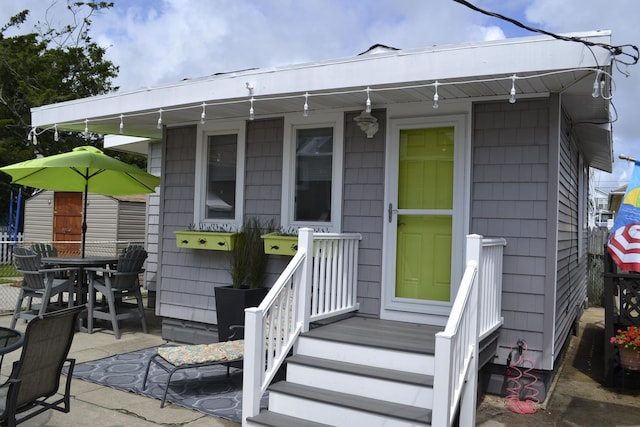 doorway to property featuring a patio area