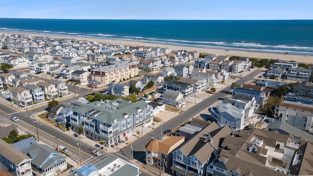 aerial view with a water view and a view of the beach