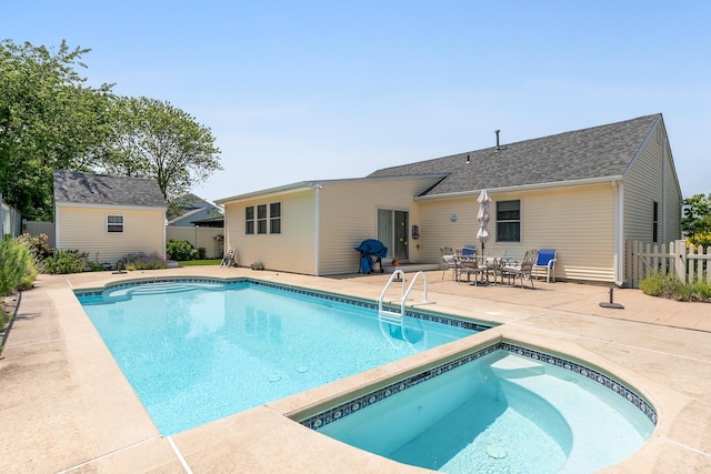 2710 Bybrook Dr, Cape May Beach, NJ 08251 - view of swimming pool featuring a patio, a storage unit, and a pool with connected hot tub