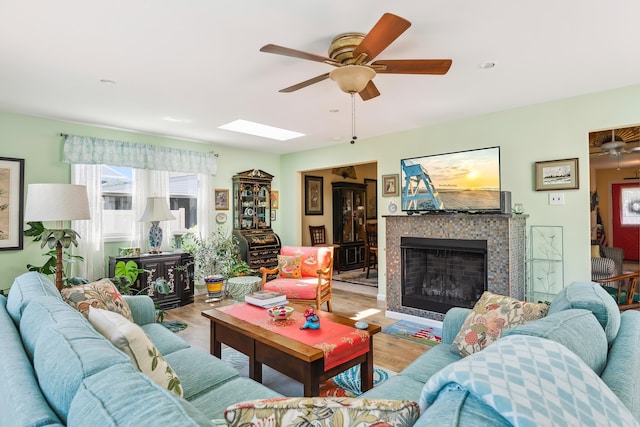 2710 Bybrook Dr, Cape May Beach, NJ 08251 - living area with ceiling fan, wood finished floors, a fireplace, and a skylight